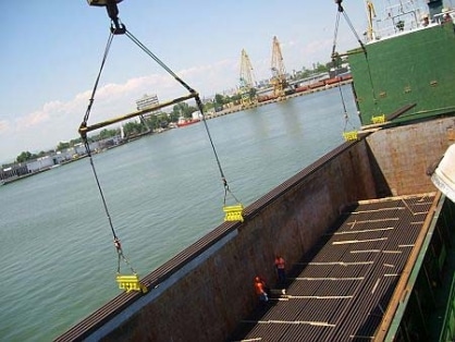 a crane lifting steel bars