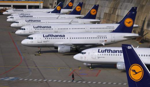 a group of airplanes parked on the tarmac