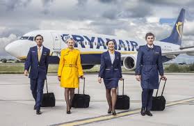 a group of people walking with luggage