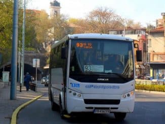 a white bus on the street