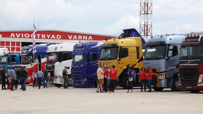 a group of trucks parked in a parking lot
