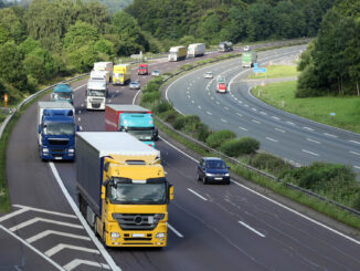 a group of trucks on a highway