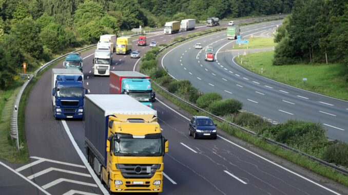 a group of trucks on a highway