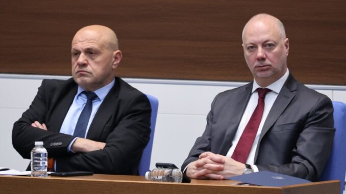 two men sitting at a table