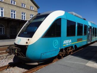 a blue train on tracks