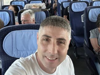 a man taking a selfie in an airplane
