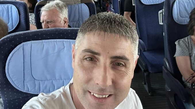 a man taking a selfie in an airplane